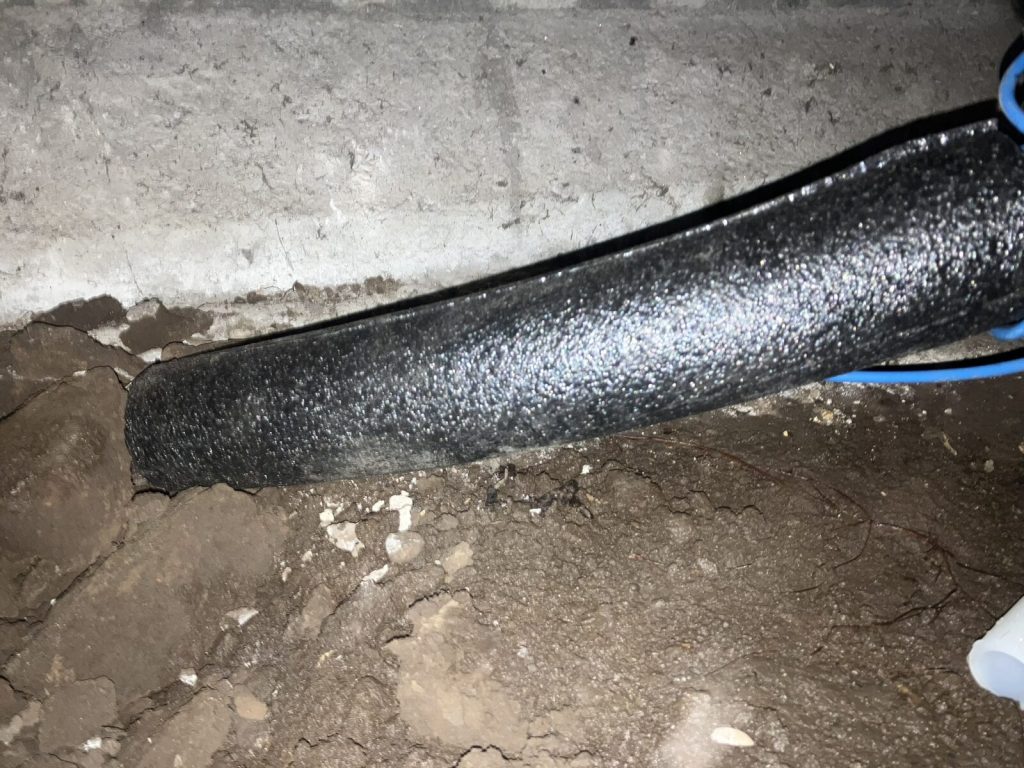 Insulated water line running through an open trench