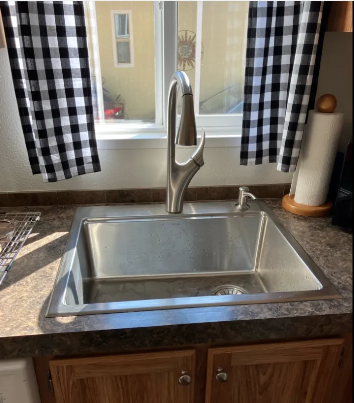 Kitchen sink and faucet after a plumbing install