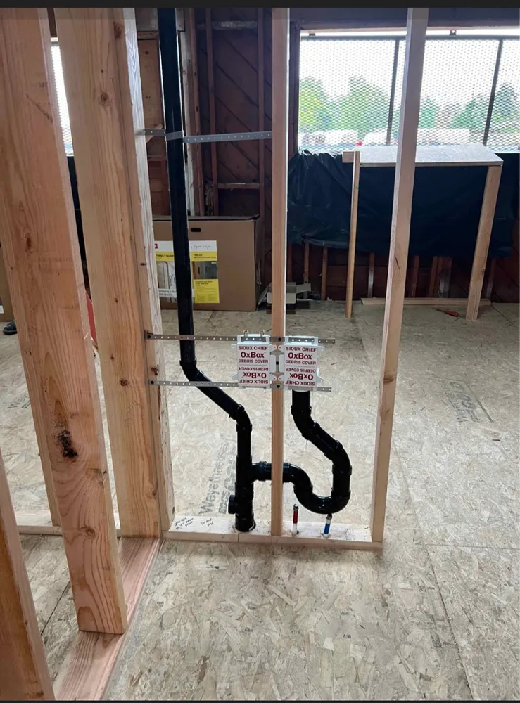New drain and vent rough-in inside a framed wall