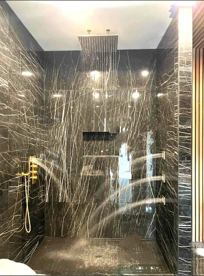 Finished shower with a rain head and body sprays
