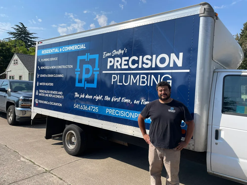 Precision Plumbing box truck parked for a service call