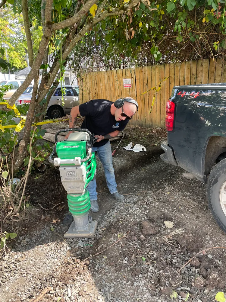 Excavation beside a house for a water line
