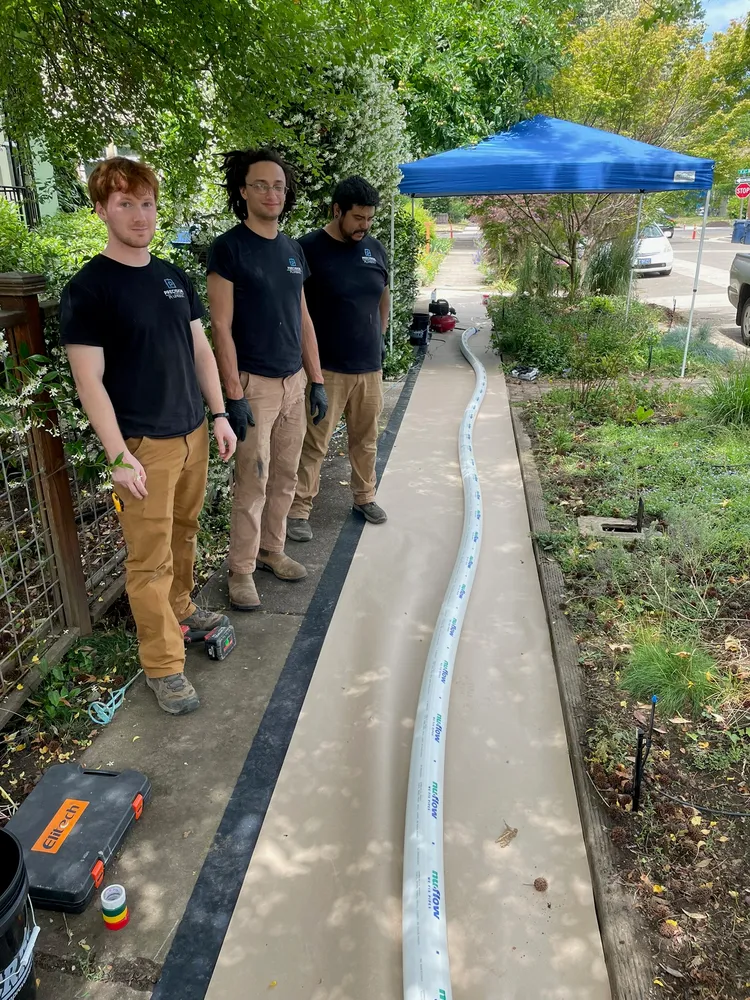 Water line trench along a sidewalk