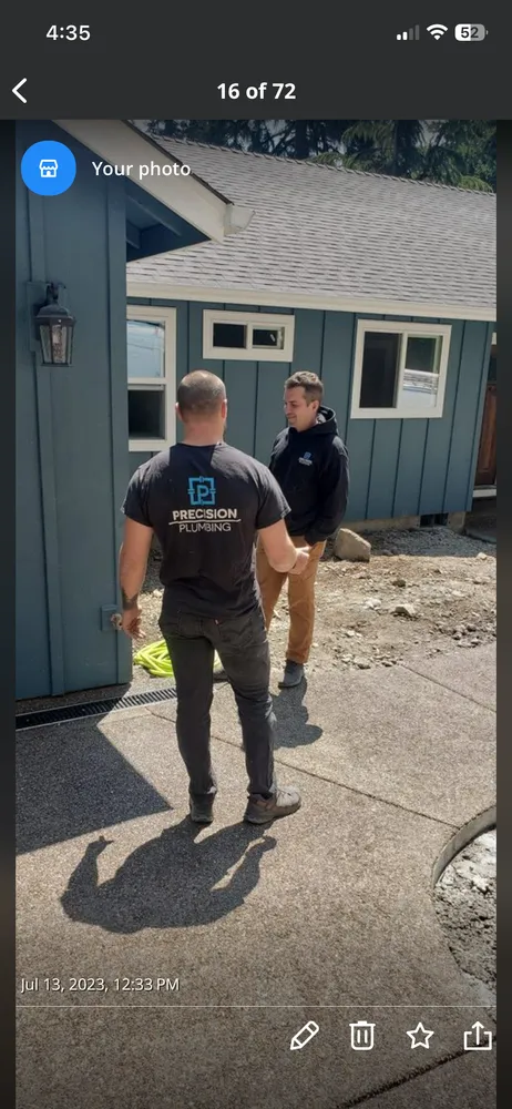 Precision Plumbing technician working at a house