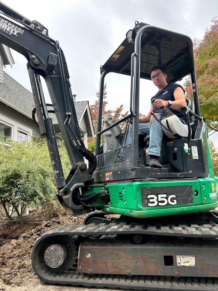 Excavator staged for a sewer replacement