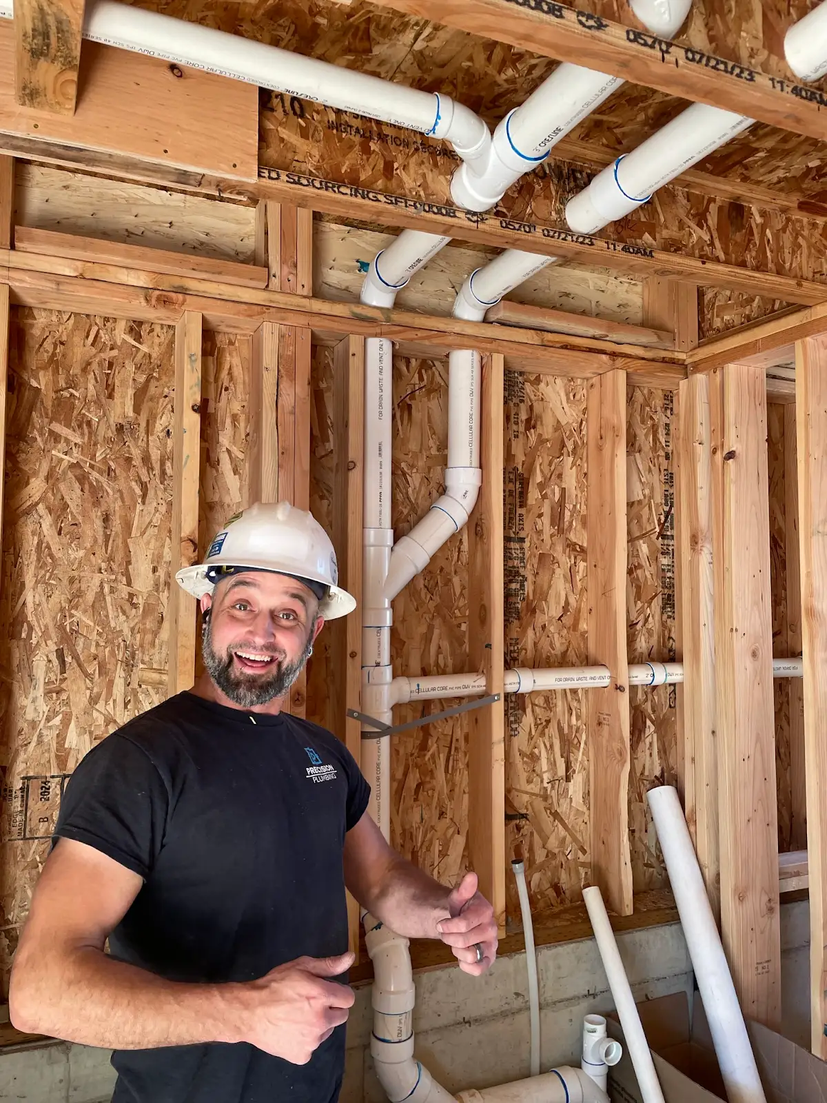 Precision Plumbing crew installing plumbing rough-in during new construction