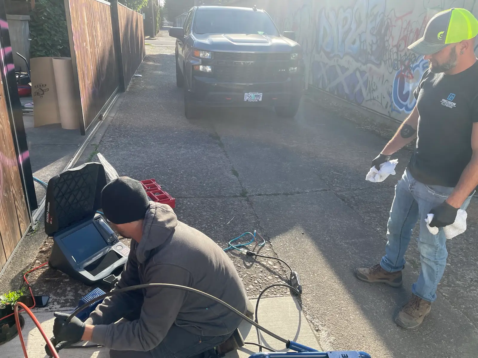 Precision Plumbing crew performing a sewer camera inspection